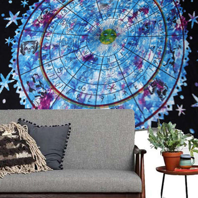 Colorful astrology tapestry featuring zodiac symbols and a vibrant design, complementing a cozy sofa and plant.